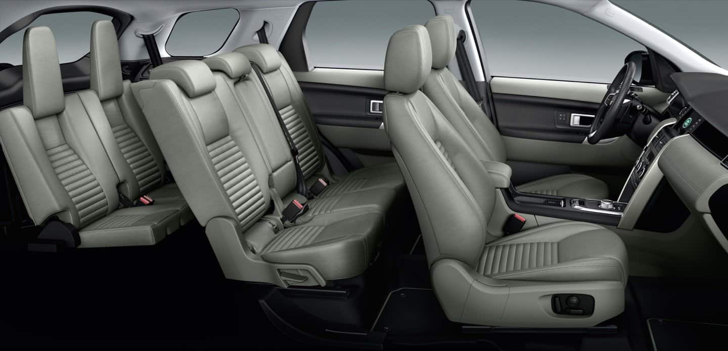 Vehicle interior showing seat backs, door panels and sun visors
