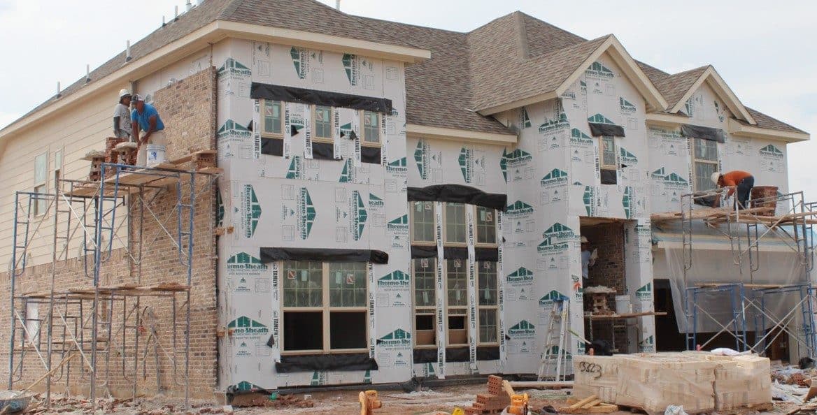 House under construction with paperboard exterior sheathing installed